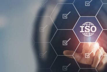 ISO standards quality control, assurance and warranty business technology concept. Touching on screen with ISO and globe icons on smart background. ISO Standard certification. Modern ISO banner.